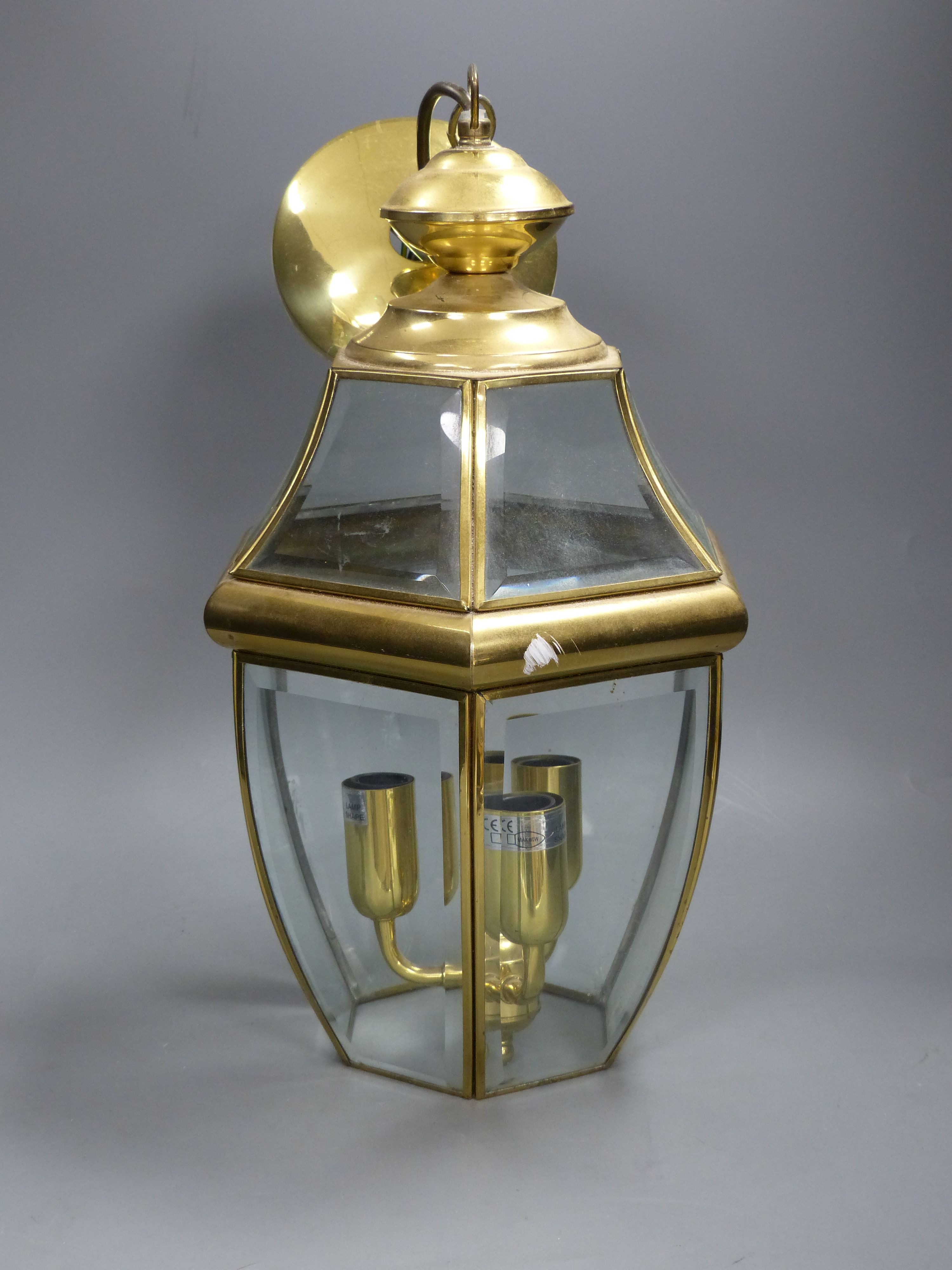 A hexagonal gilt metal and glass hall lantern